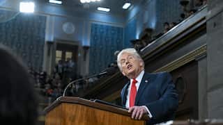 President Trump stands at a podium in Congress to deliver the state of the union address.