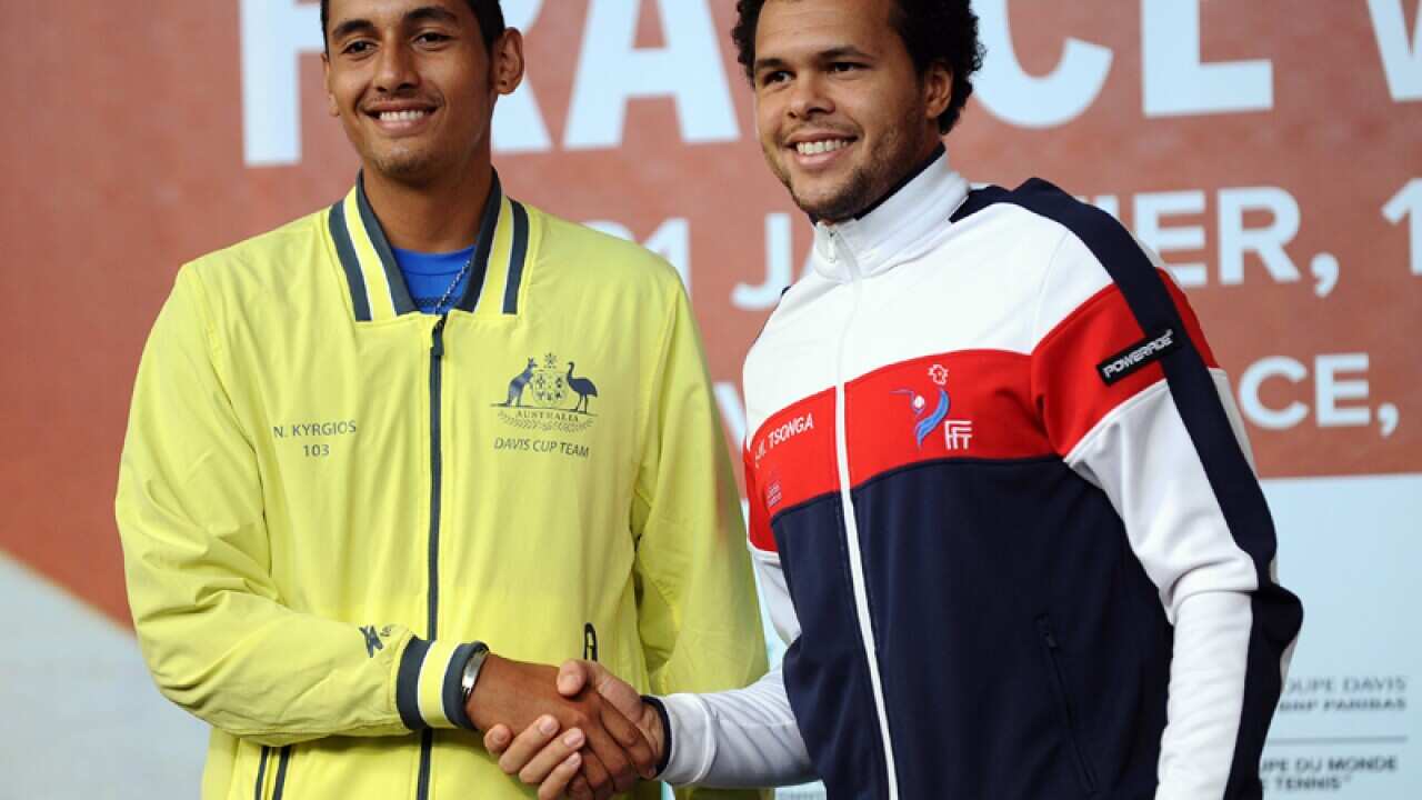 Teenager Nick Kyrgios (L) shakes hands with Jo-Wilfried Tsonga