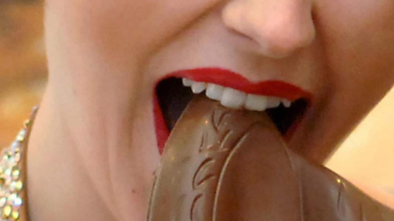 A woman eating chocolate