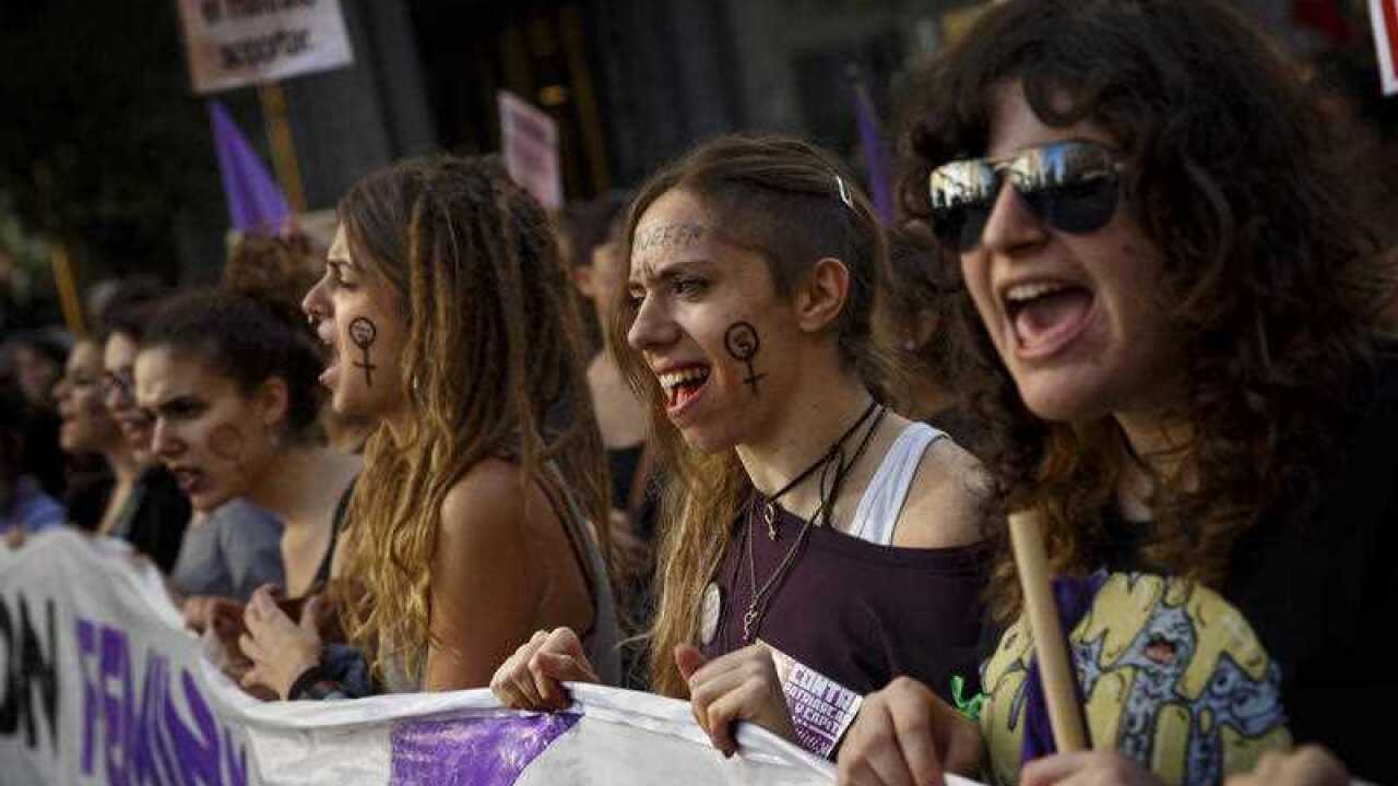 Protesters shout slogans as they march during a demonstration against domestic violence towards women, in Madrid, Spain