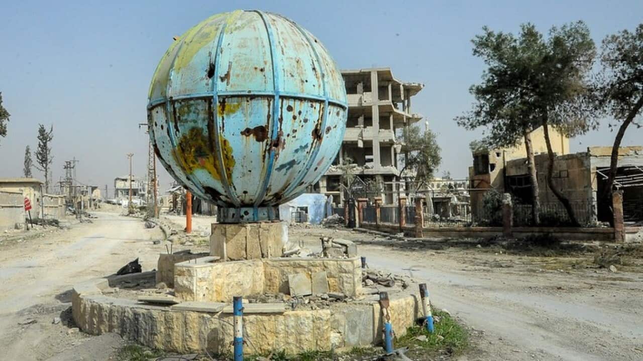 Official Syrian Arab News Agency image shows damaged buildings in al-Muhamadyia town in Eastern Ghouta