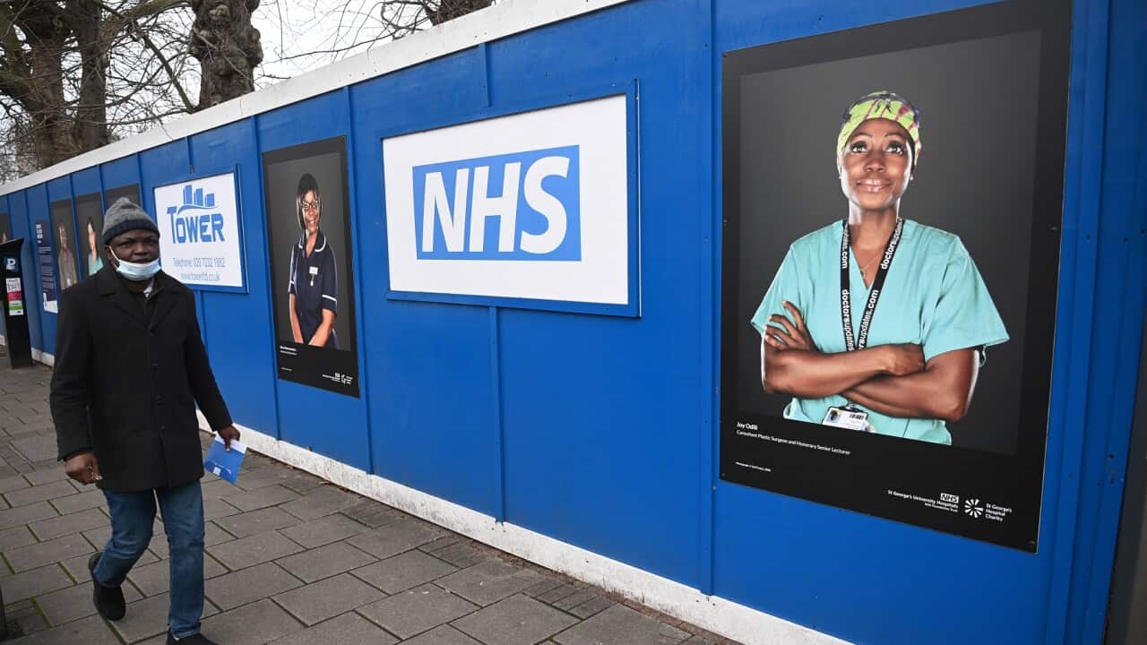 A man passes a temporary 'Nightingale' field hospital in South London
