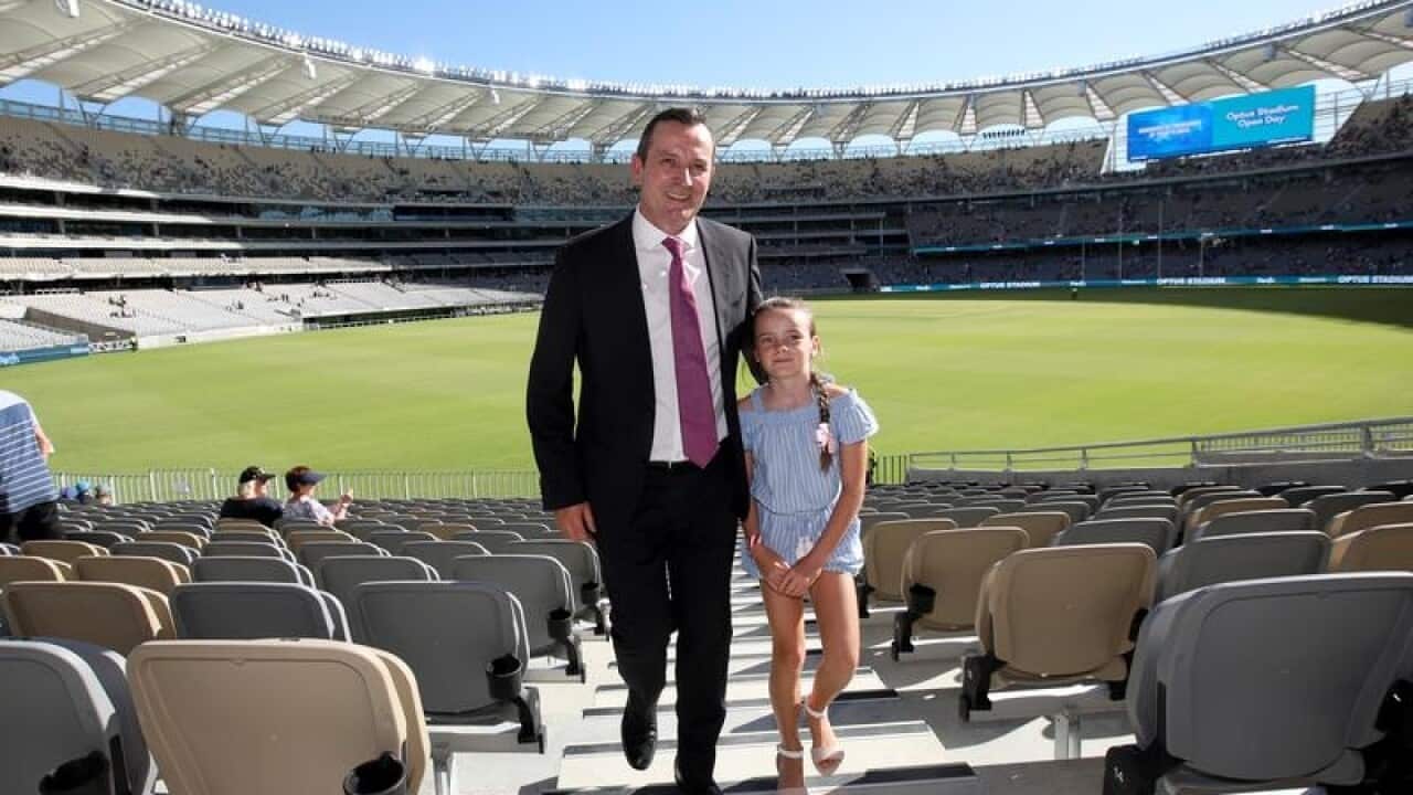 WA Premier Mark McGowan and daughter Amelia look at Optus Stadium.
