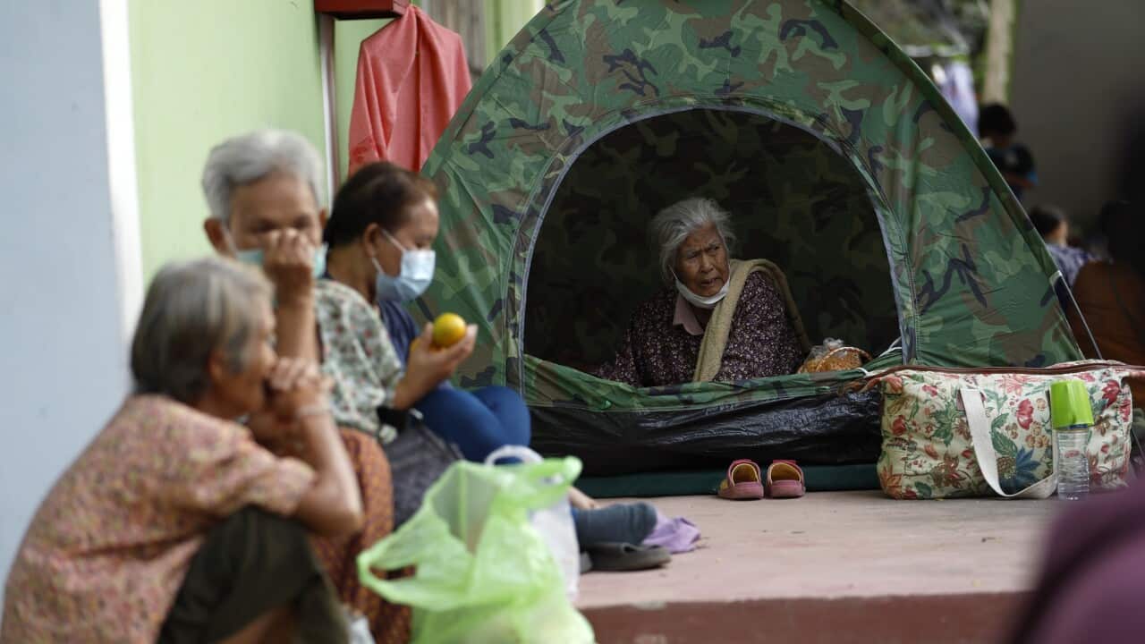 Displaced Thai villagers who fled from homes following clashes between Thai and Cambodian troops, rest at a school turned into an evacuation center in Surin province, Thailand.