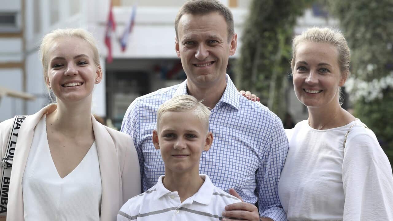 A file photo of Alexei Navalny, with his wife Yulia, daughter Daria, and son Zakhar