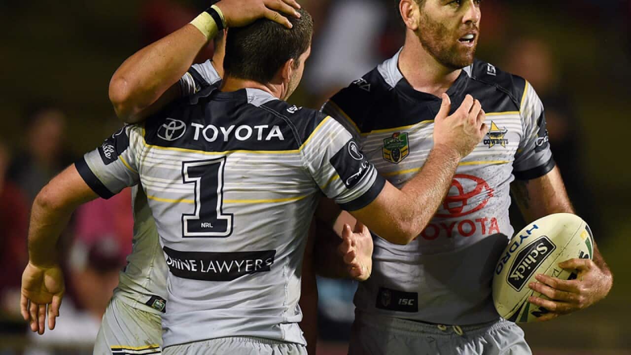 Kane Linnett of the Cowboys (R)celebrates with team mates