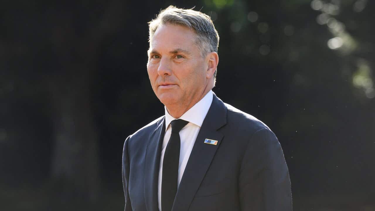 Richard Marles wearing a black suit and white shirt