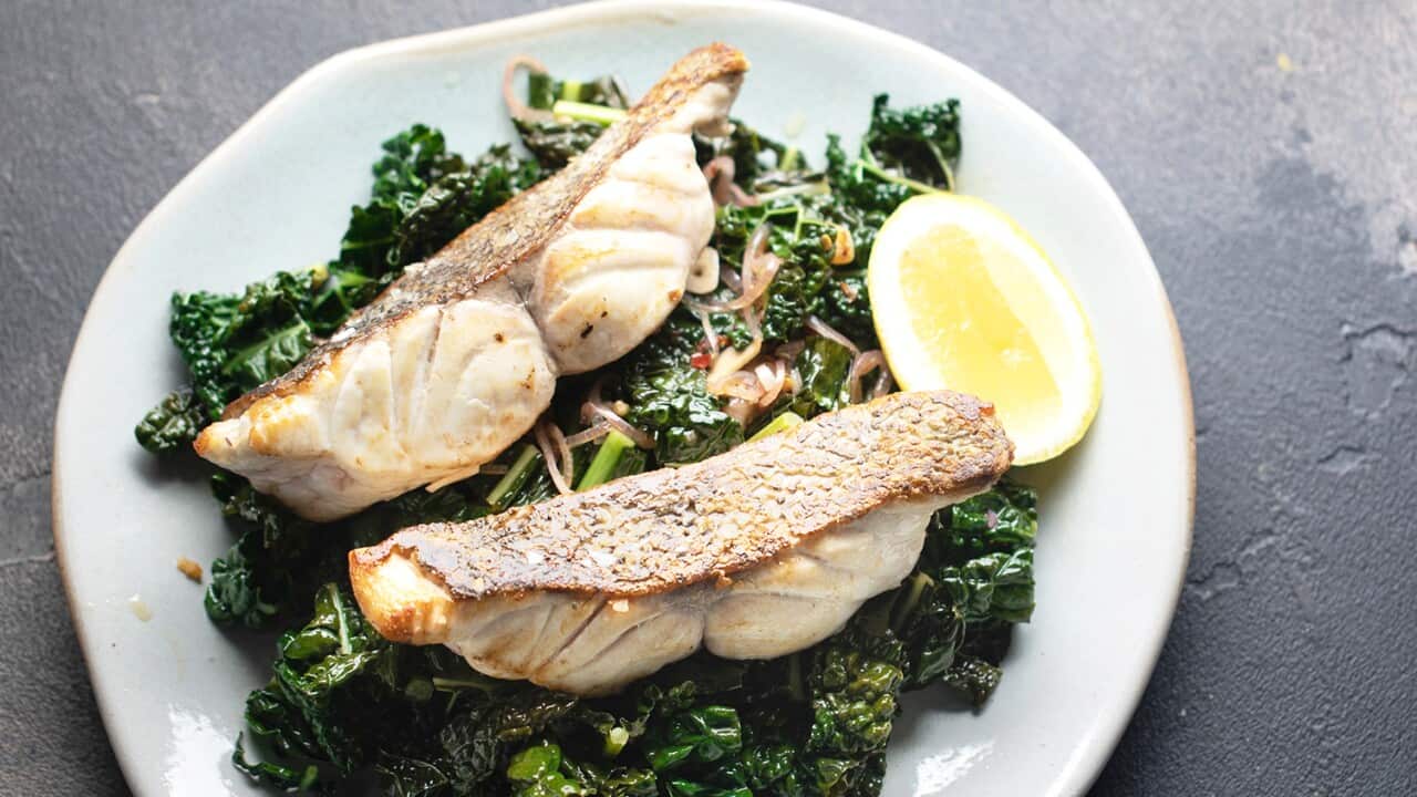 Pan-seared white fish with sautéed kale