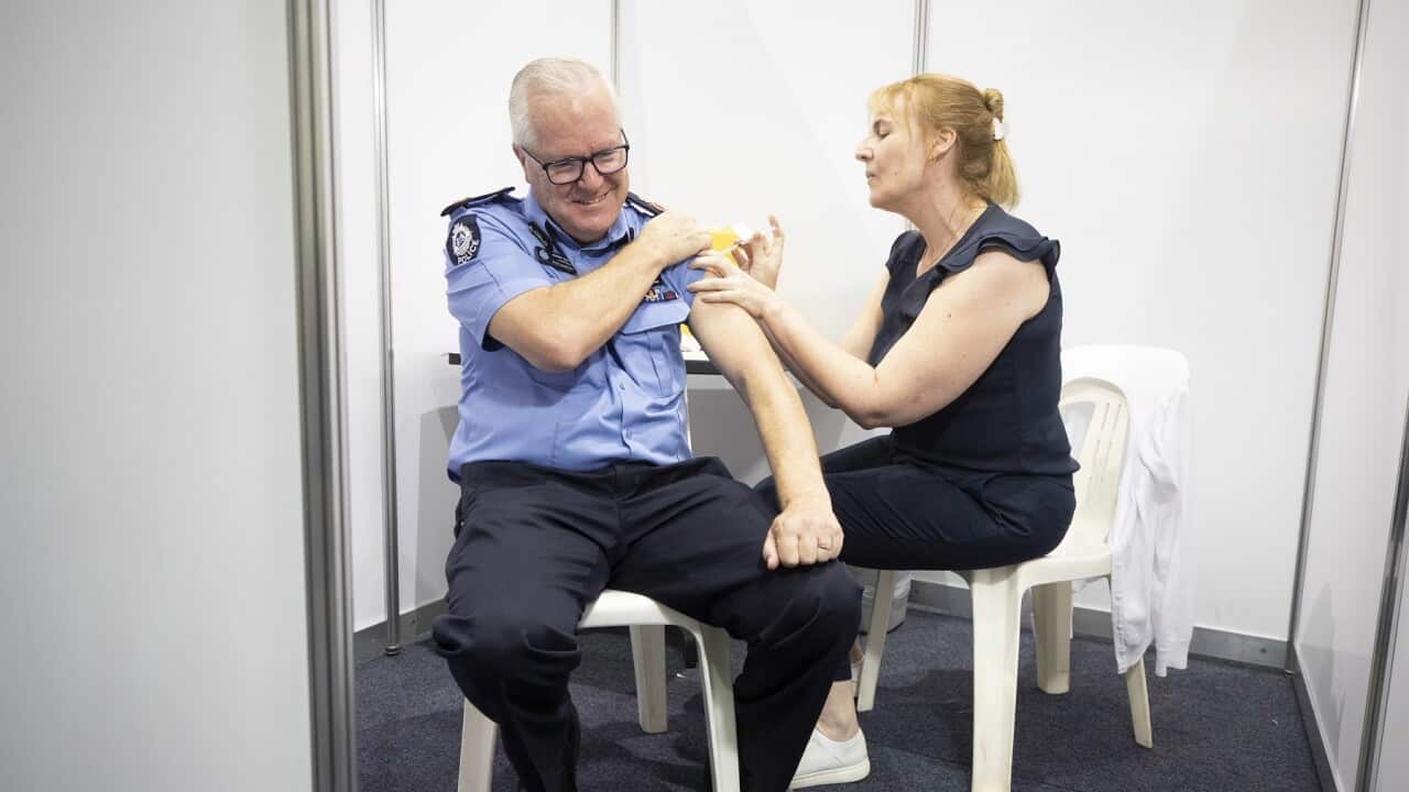 WA Police Commissioner Chris Dawson receives the vaccine at the Perth.