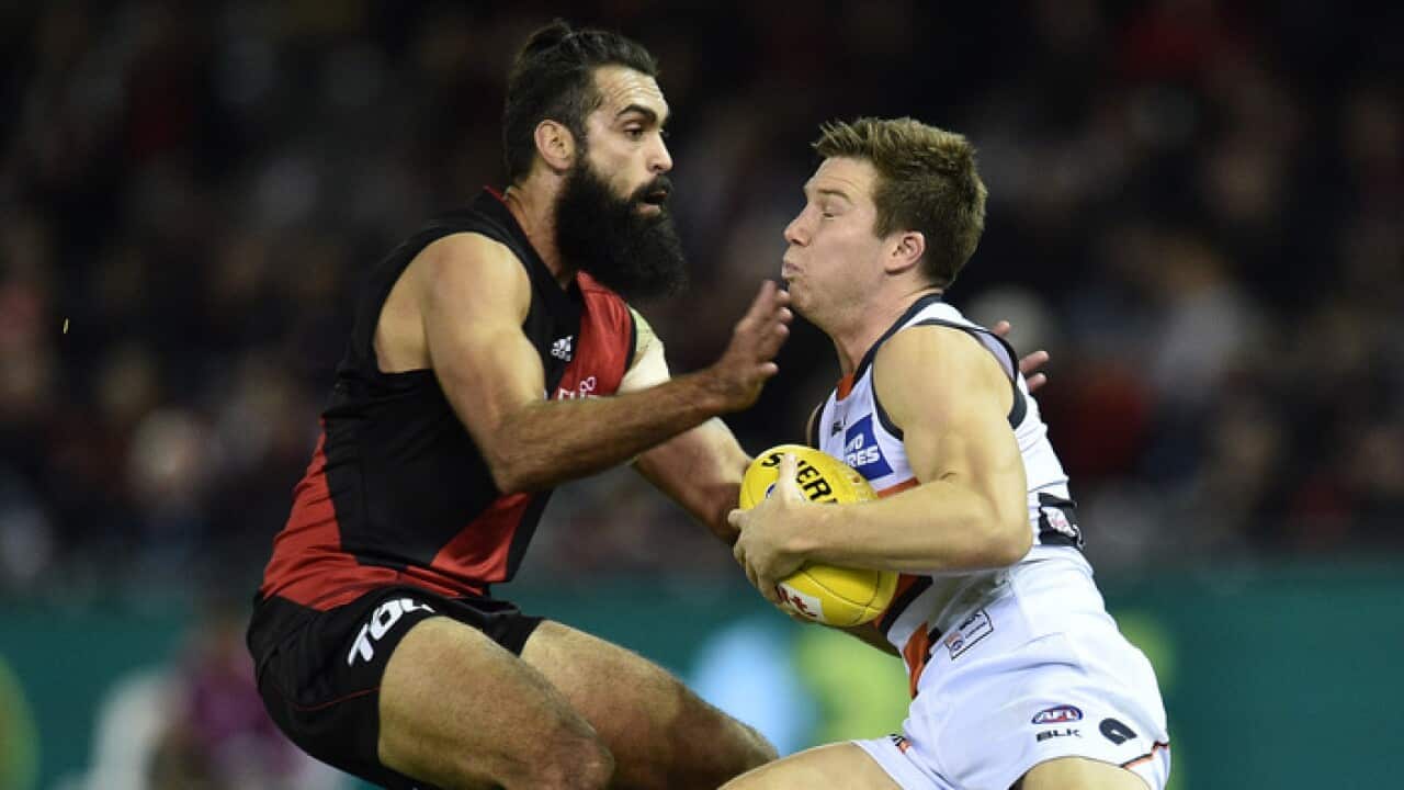 Courtney Dempsey, left, in his playing days for Essendon