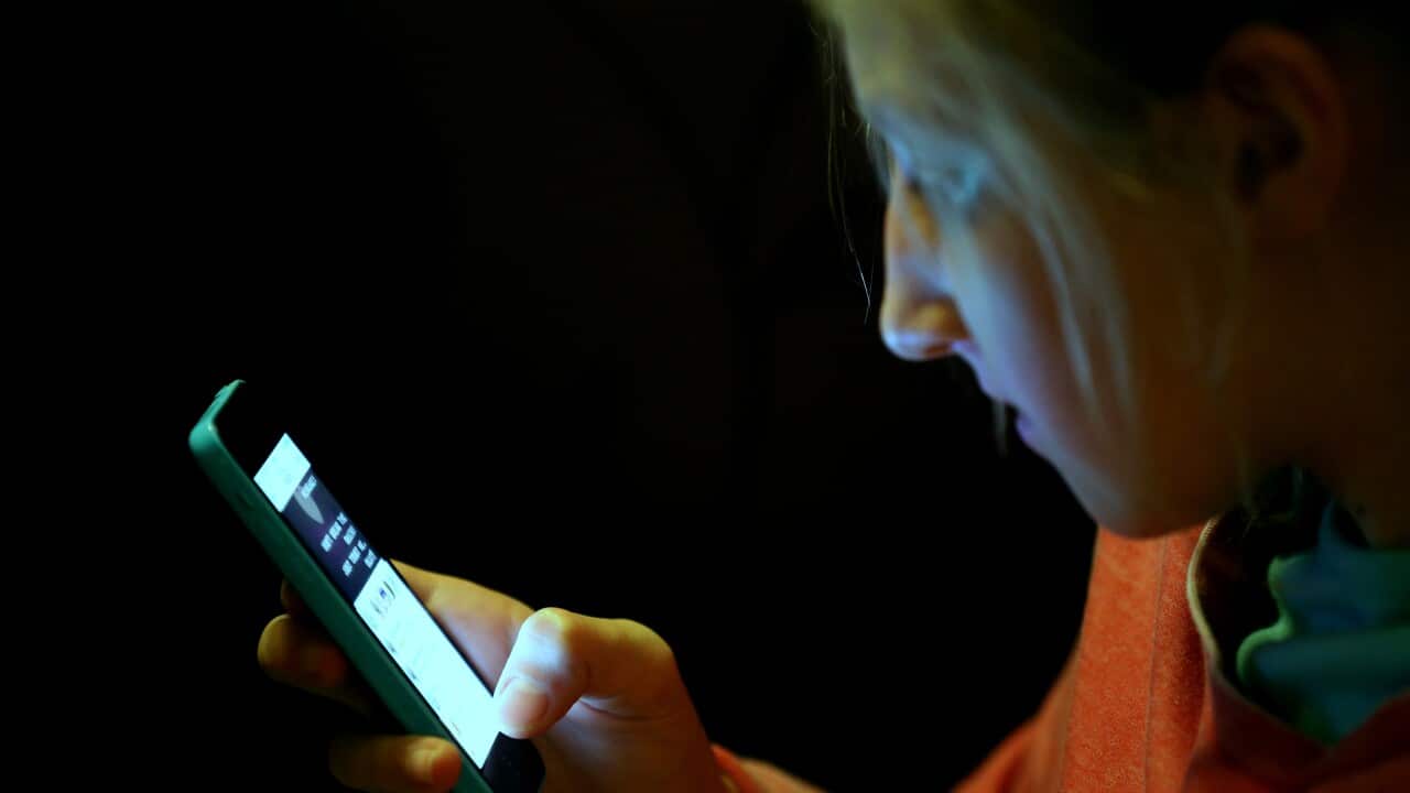 Teenager using mobile phone stock