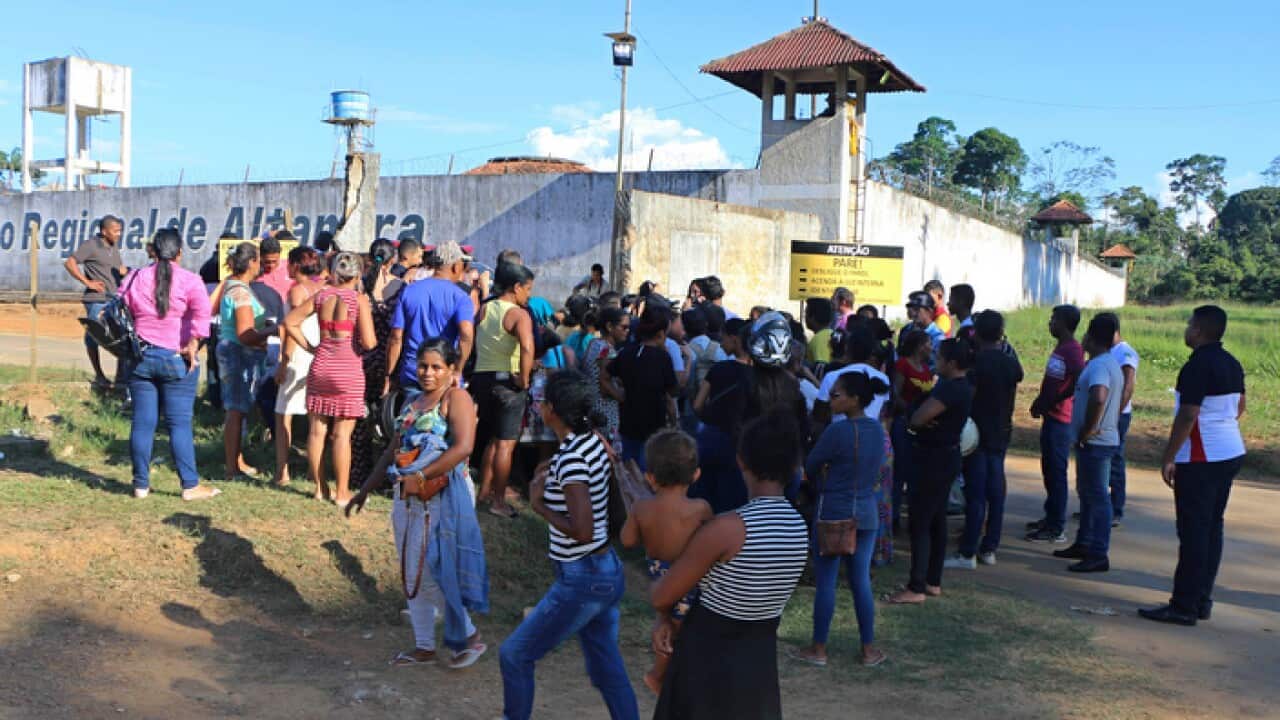 People seek information about family members who are prisoners after a riot inside the Regional Recovery Center in Altamira, Brazil