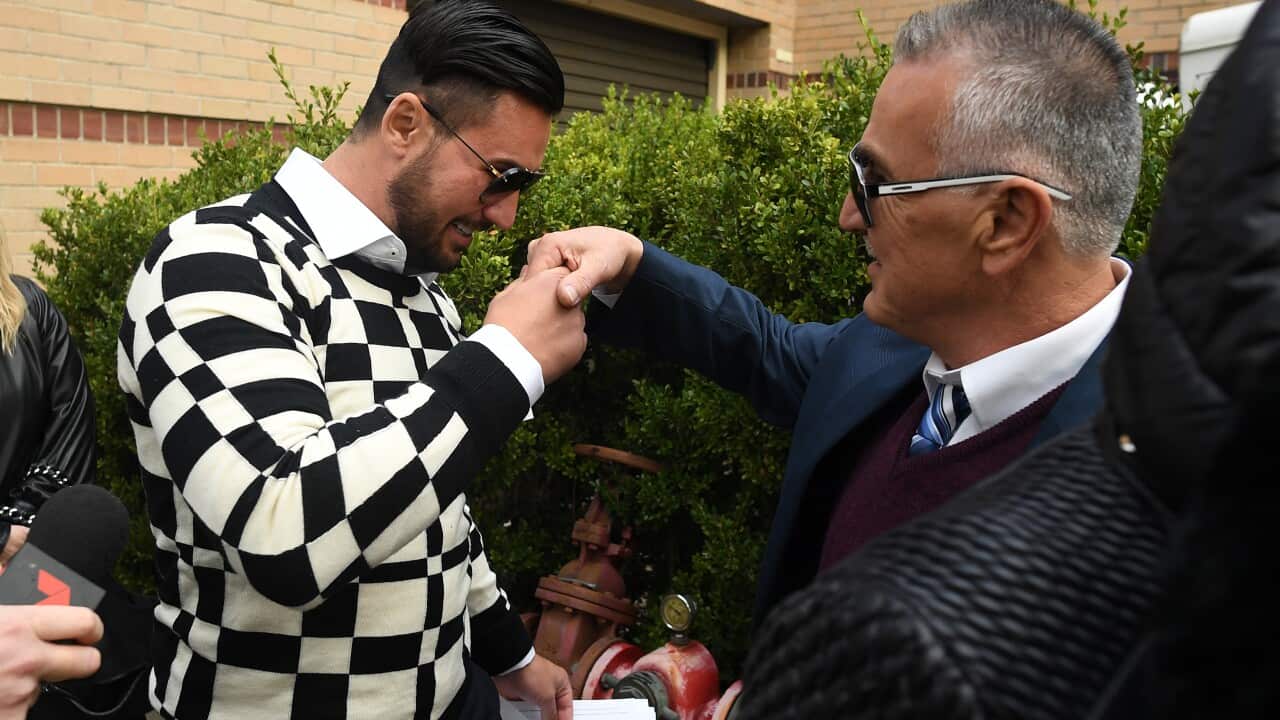 Salim Mehajer greets his father Mohamed Mehajer as he is seen leaving Burwood Court in Sydney, Tuesday, June 4, 2019. (AAP Image/Joel Carrett) NO ARCHIVING