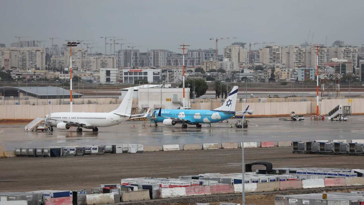 Planes parked on the tarmac.