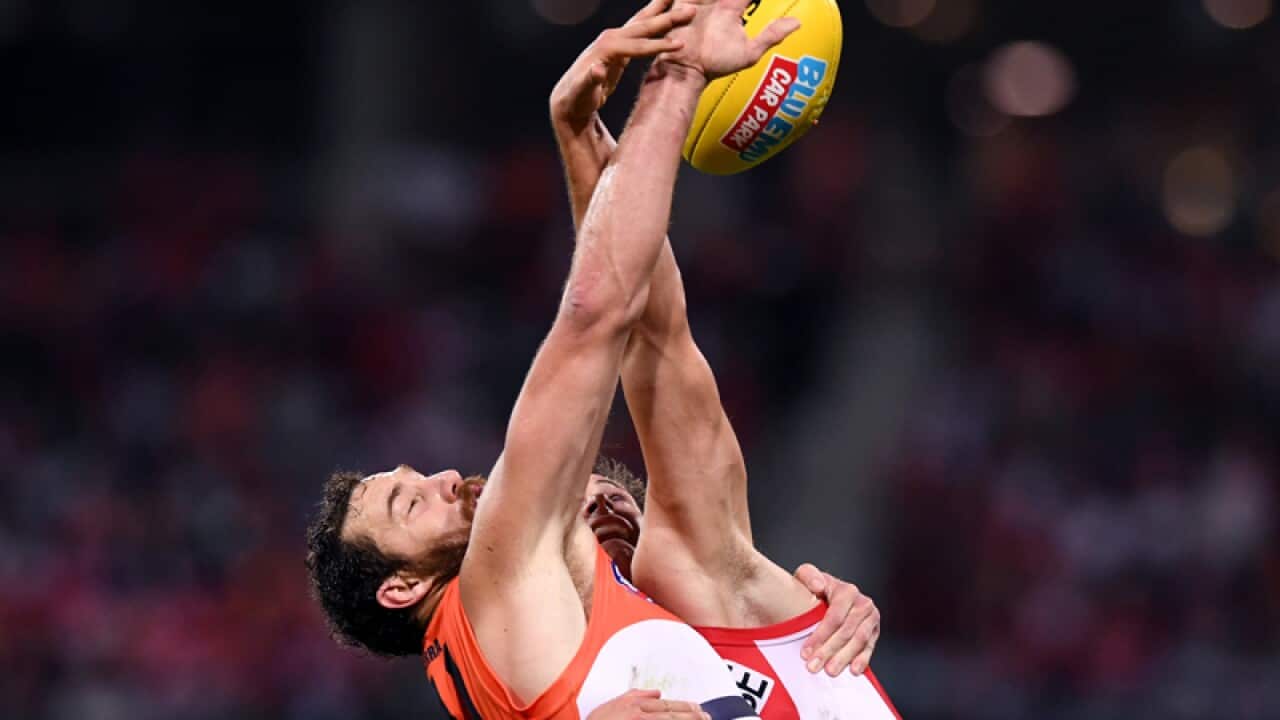 Shane Mumford (left) of the Giants