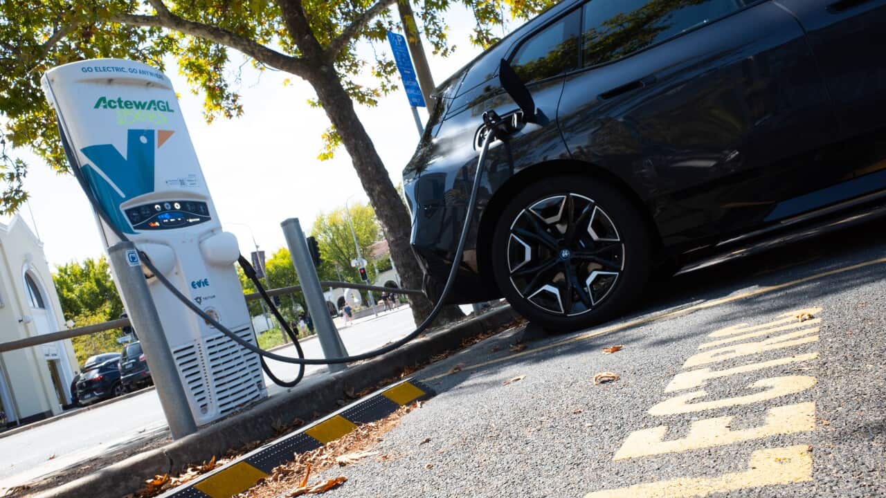 A car at an electric vehicle charging station