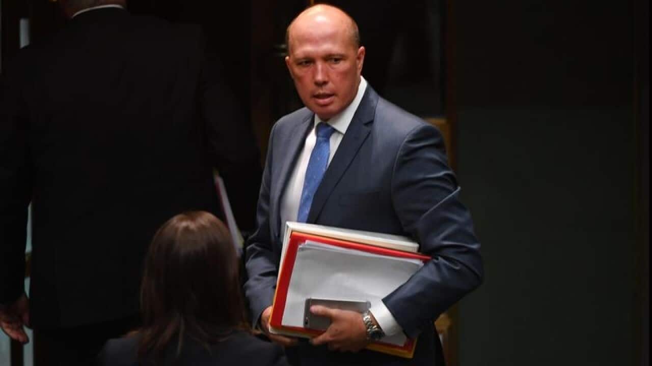 Minister for Home Affairs Peter Dutton leaves after Question Time.