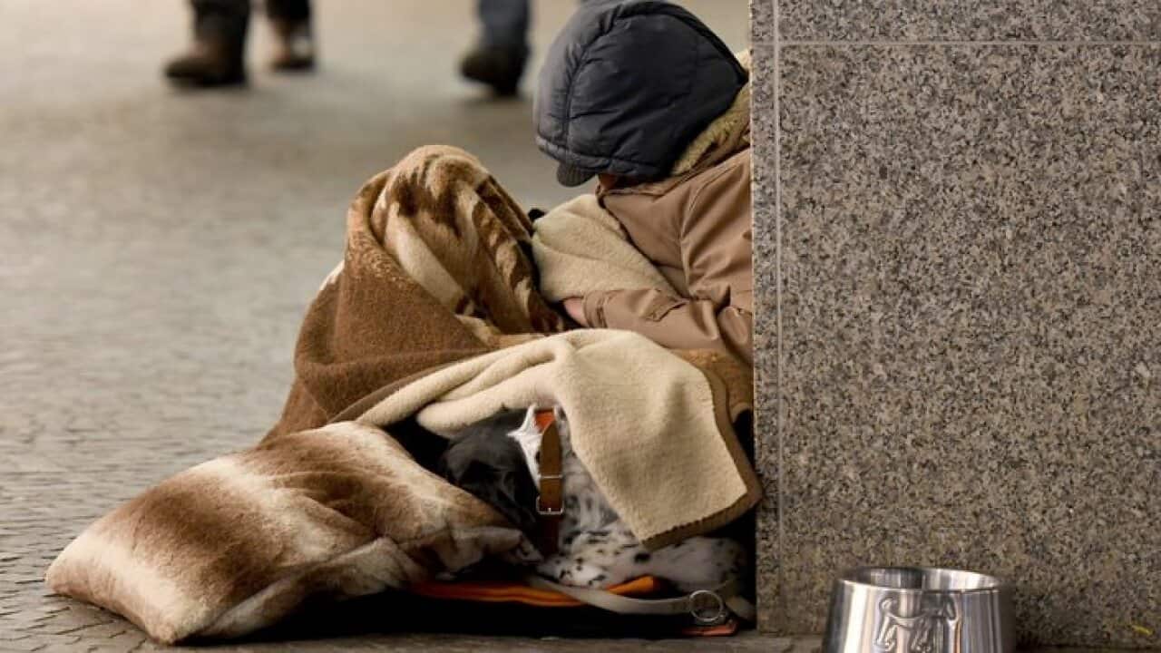 homeless man sleeping in the street, Freiburg, Feb. 14, 2018 | usage worldwide