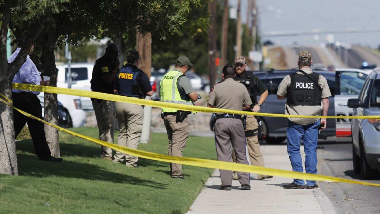 Odessa, Midand, Texas DPS and ATF officers cordon off a footpath.