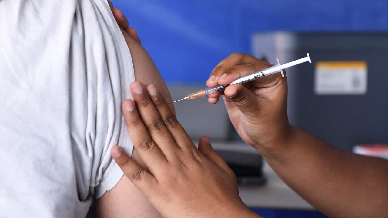 A man receives a COVID-19 vaccine at a pop-up centre in Queensland.
