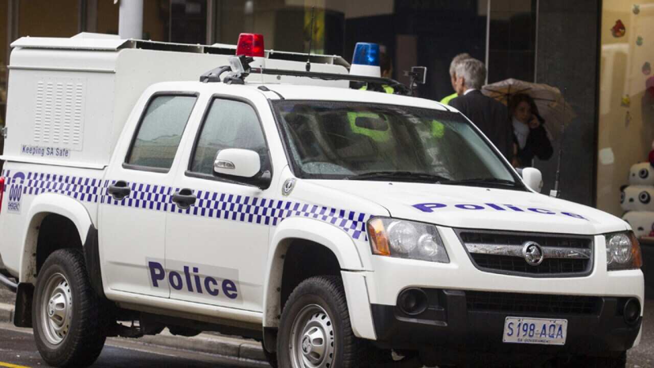 Police car parked out side Hindley Street Police Station, Adelaide