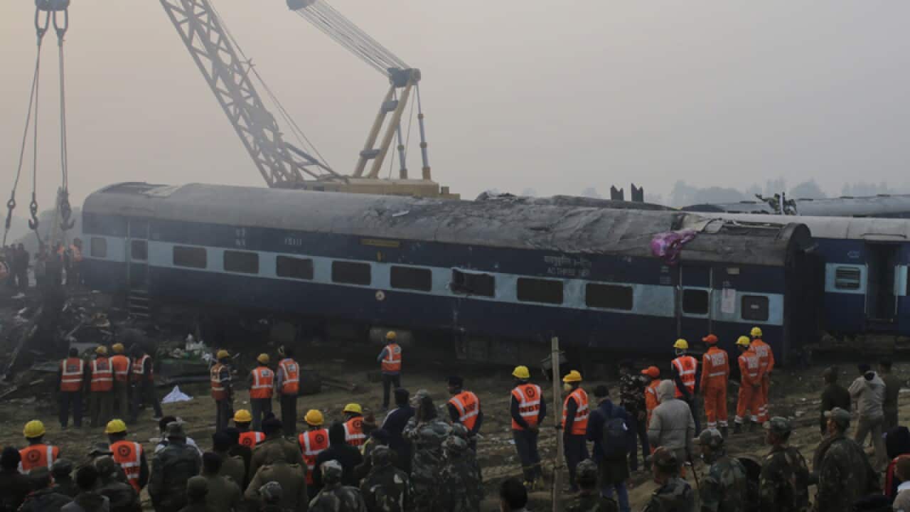 Rescuers work at the site