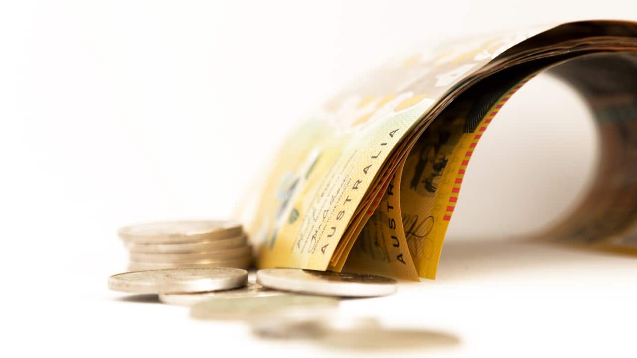 Multiple $50 Notes and a pile of coins of Australia