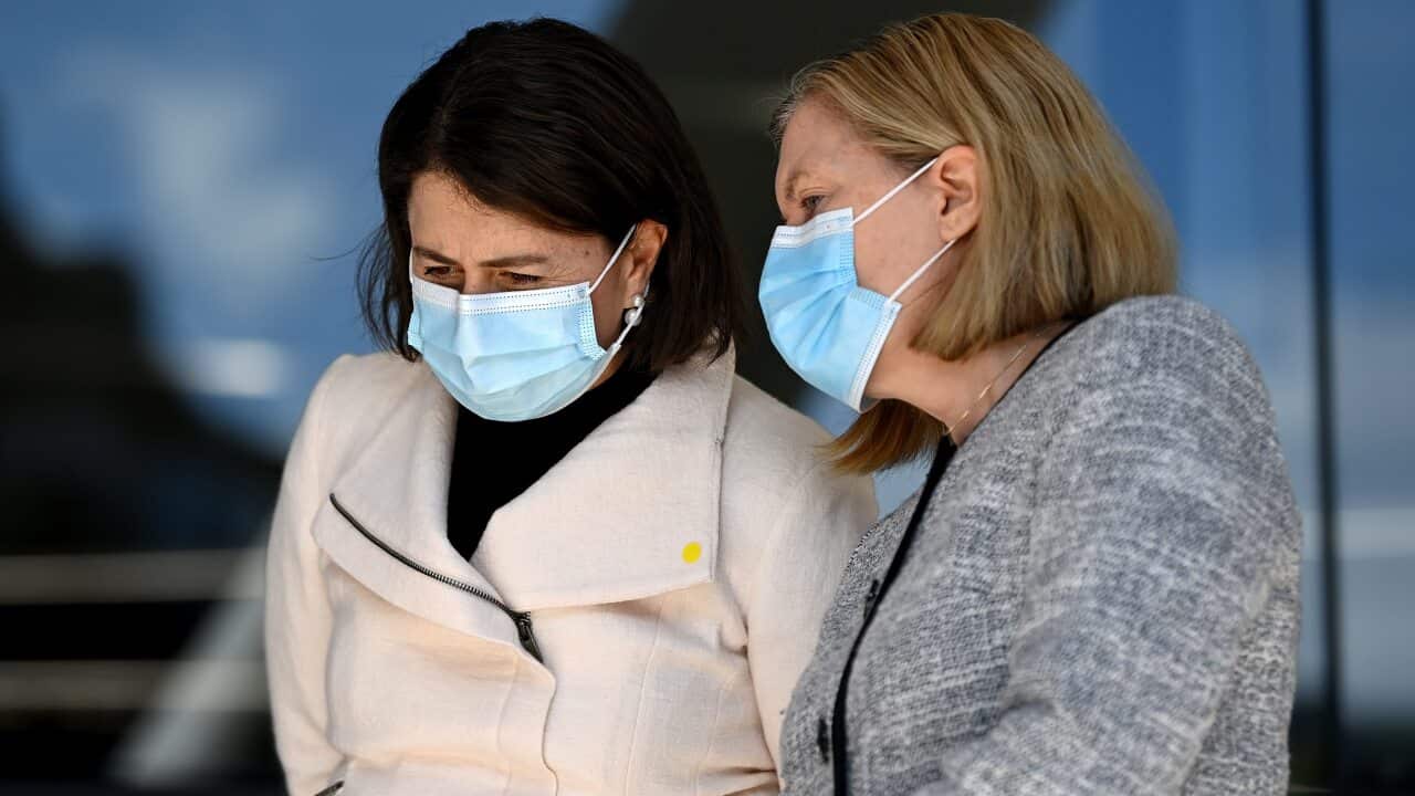 NSW Premier Gladys Berejiklian speaks to NSW Chief Health Officer Dr Kerry Chant during a COVID-19 press conference in Sydney.