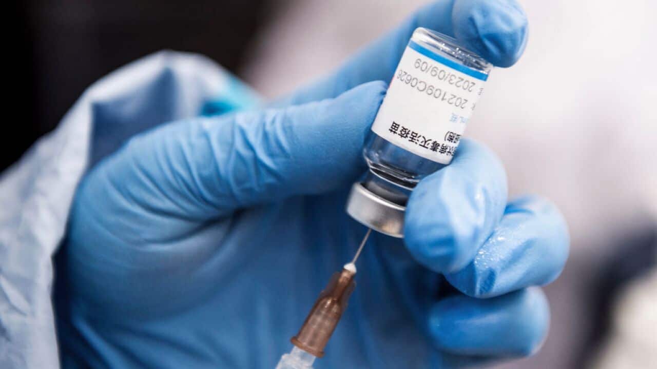 A medical worker prepares a dose of the Sinopharm Covid-19 coronavirus vaccine at a hospital in Wuhan in China's central Hubei province on November 25, 2021. - China OUT (Photo by AFP) / China OUT (Photo by STR/AFP via Getty Images)