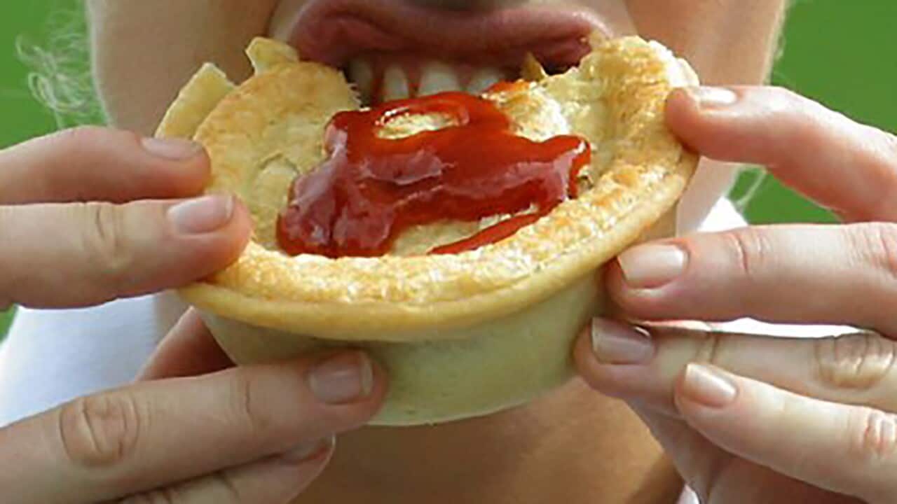 Woman eating a pie