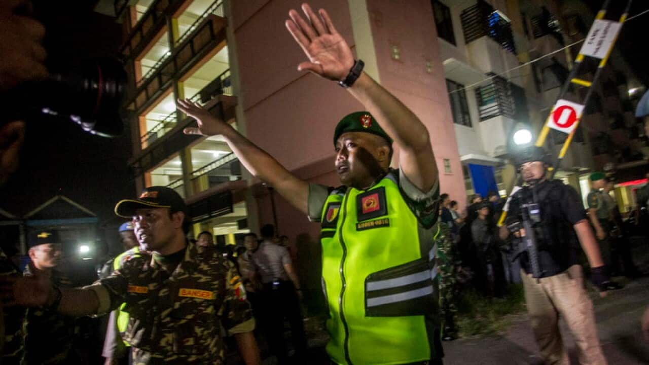 Police at the scene of one of the Surabaya bombings