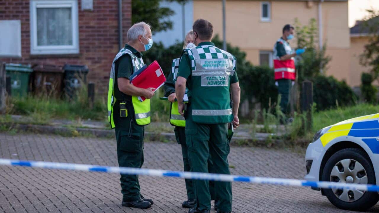 Police at the the scene following a shooting in Keyham in Plymouth, England.