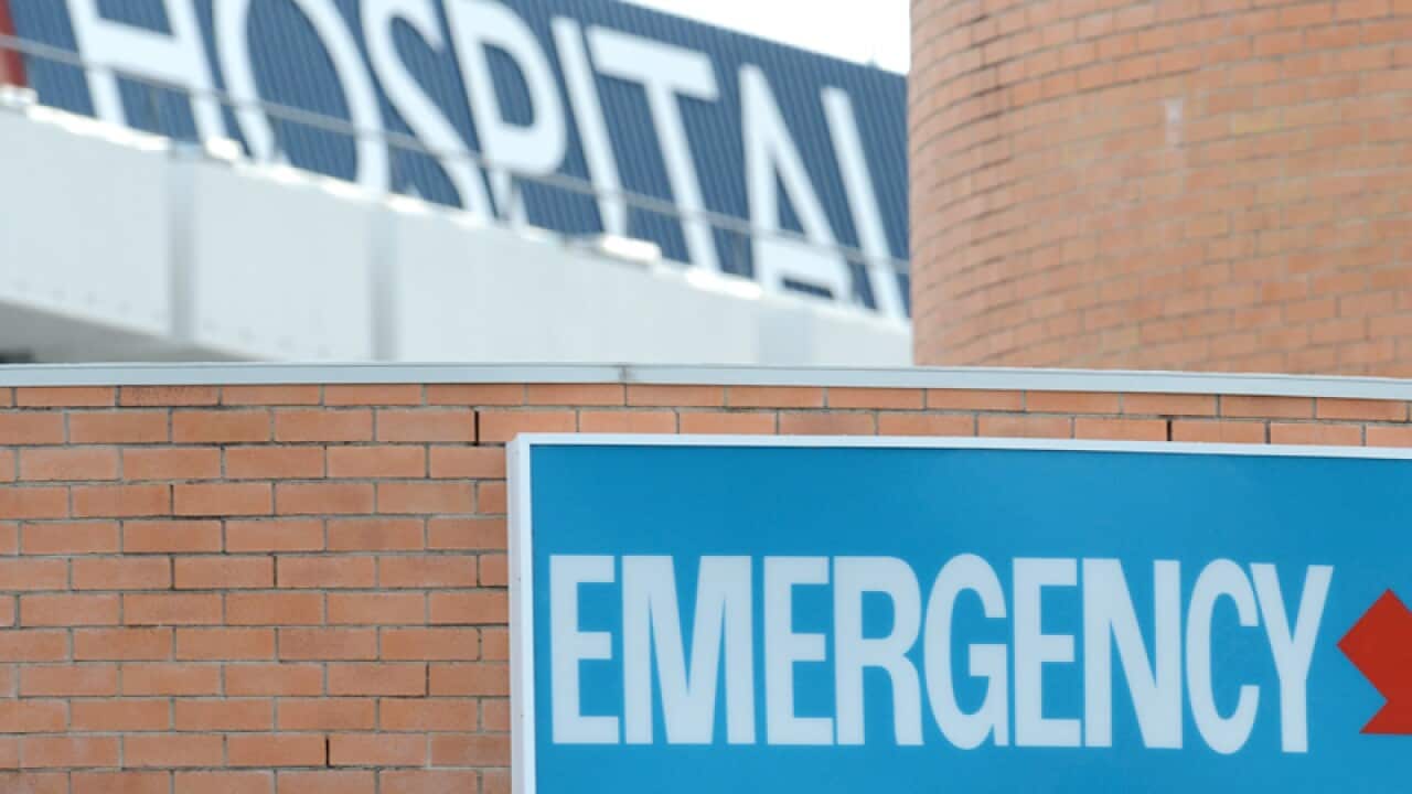 An emergency department sign at the entrance to a hospital