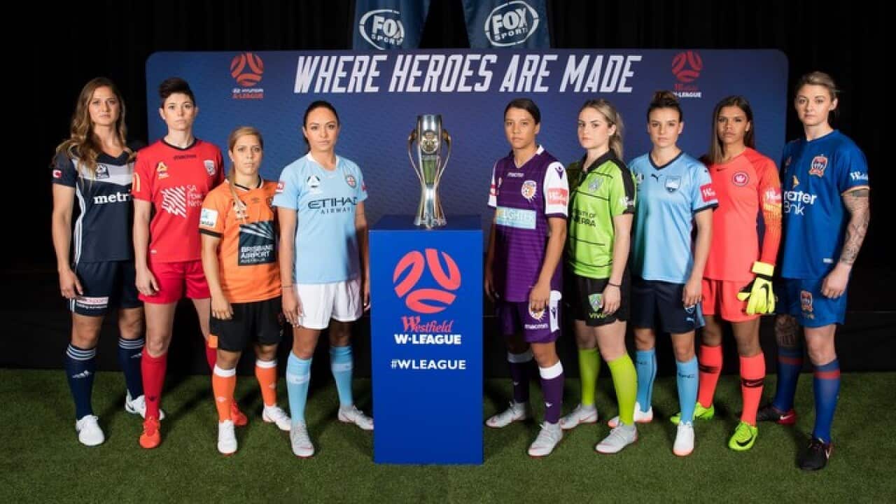 The W-League trophy and the 8 captains