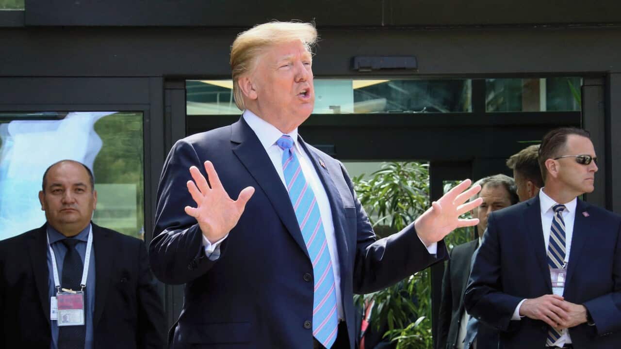 U.S. President Donald Trump speaks to reporters in Charlevoix, Canada, on June 9, 2018.