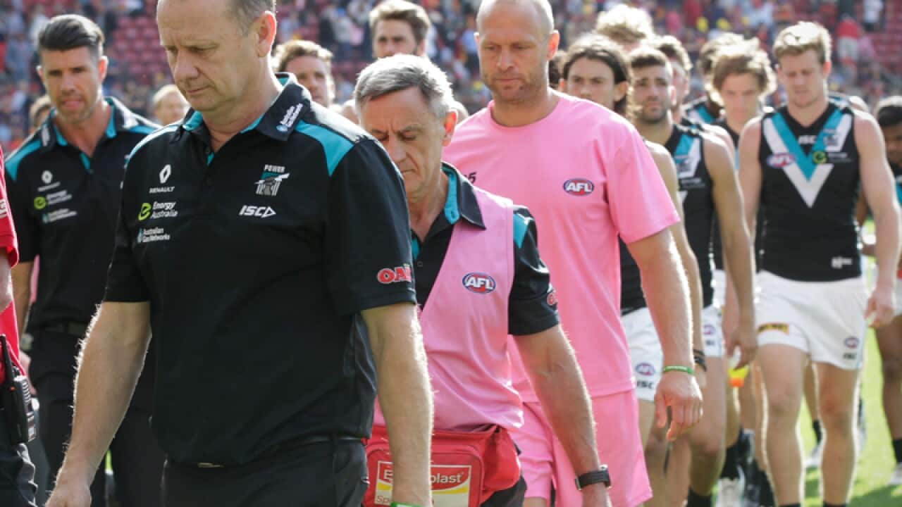Port Adelaide Coach Ken Hinkley leads his team off Adelaide Oval