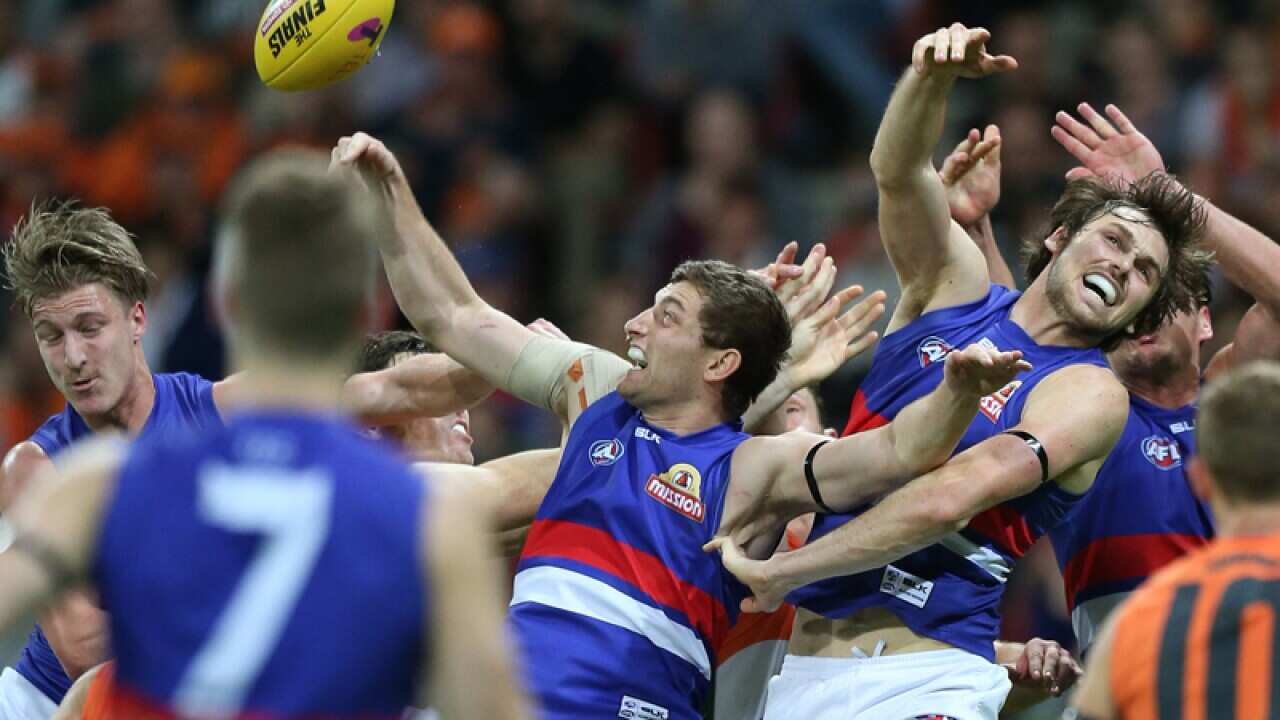 Fletcher Roberts and Joel Hamling of the Bulldogs contest a mark