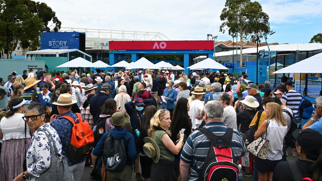 Spectators queue to enter through gates on Day 1 of the 2023 Australian Open tennis tournament at Melbourne Park in Melbourne,