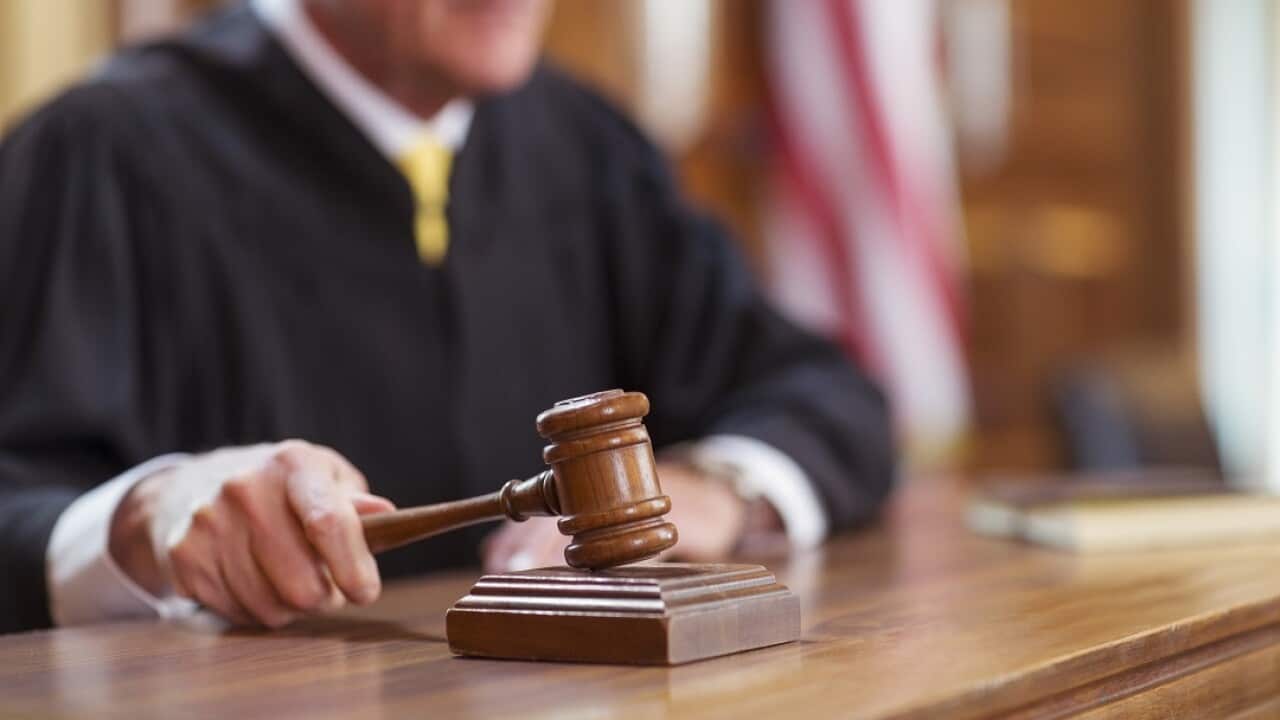 Judge banging gavel in court
