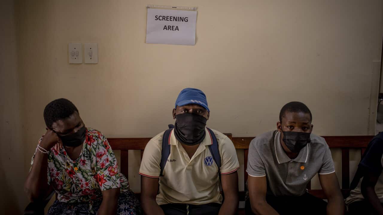 Citizens line up for a vaccine at a government-run clinic in Hillbrow, Johannesburg
