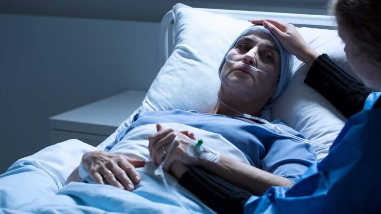 Volunteer supporting dying woman