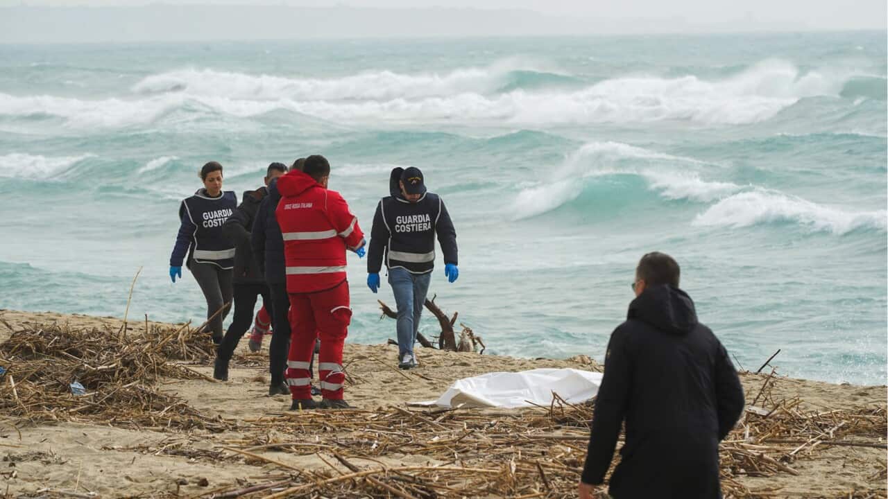Authorities near the scene of the migrant drowning (AAP).jpg