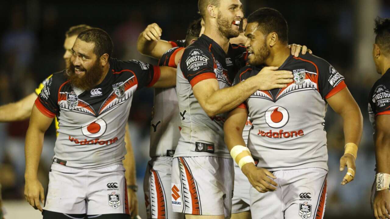 The New Zealand Warriors celebrate after the fulltime siren.