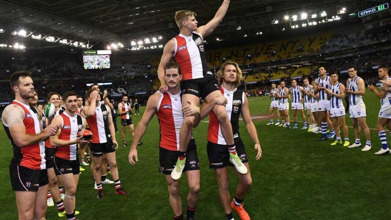 Nick Riewoldt is chaired off Etihad Stadium
