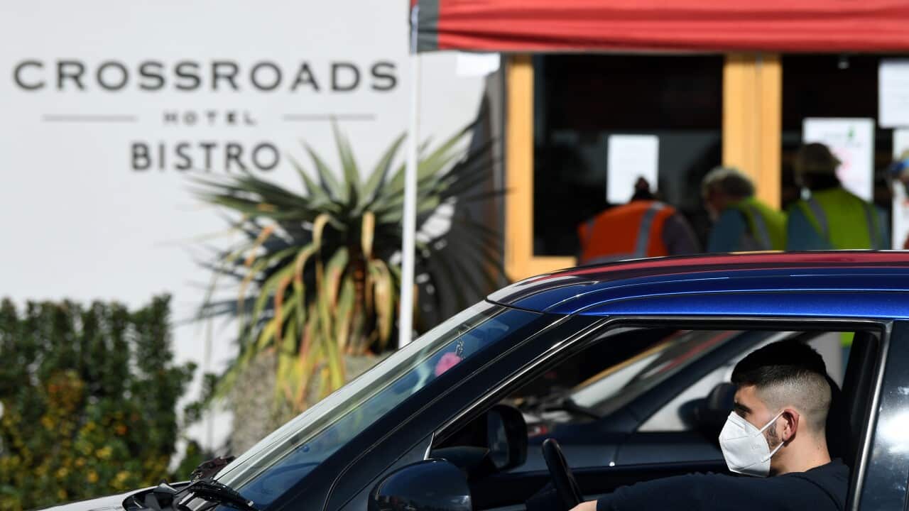 A man waits at the Crossroads Hotel testing centre in Sydney, Monday, July 13, 2020. (AAP Image/Joel Carrett) NO ARCHIVING