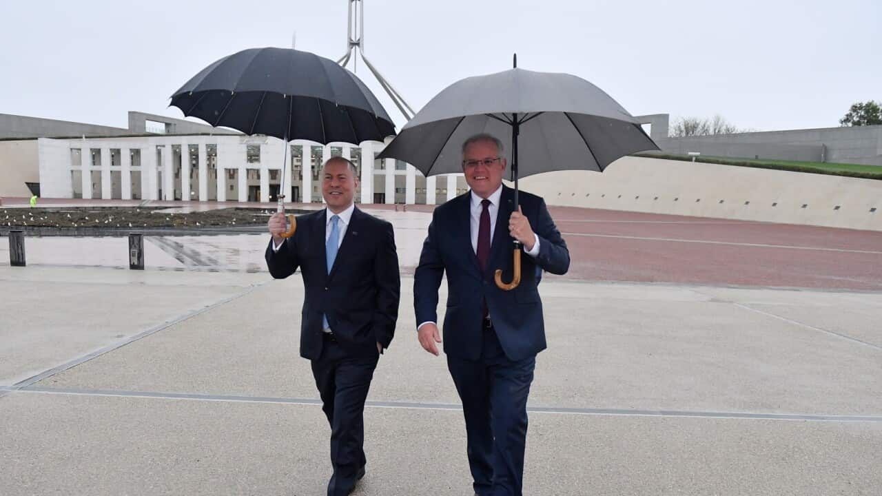 Treasurer Josh Frydenberg and Prime Minister Scott Morrison arrive to do interviews with breakfast television shows on the lawns of Parliament House in Canberra, Wednesday, October 7, 2020. (AAP Image/Mick Tsikas) NO ARCHIVING