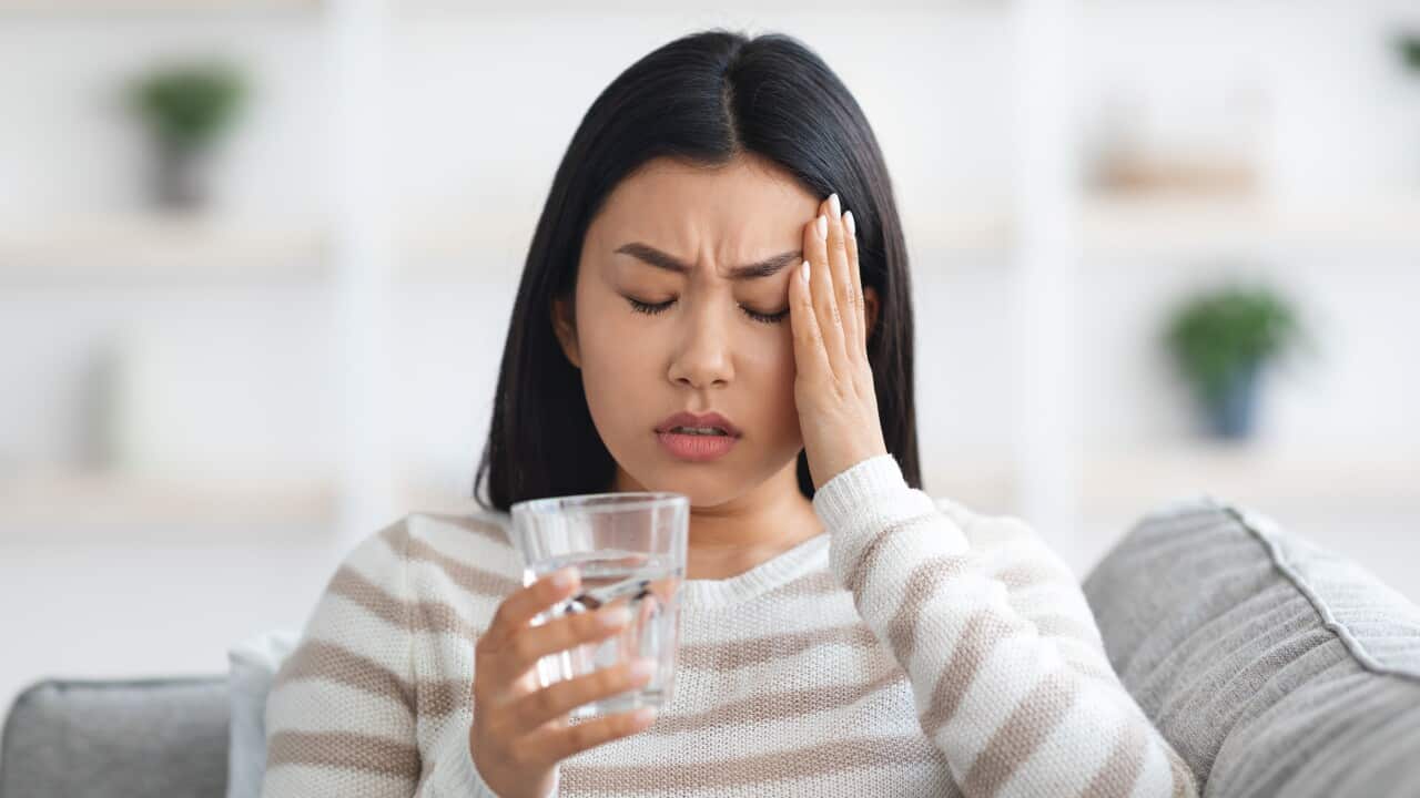 Headache Concept. Sick Young Asian Female Suffering From Migraine At Home