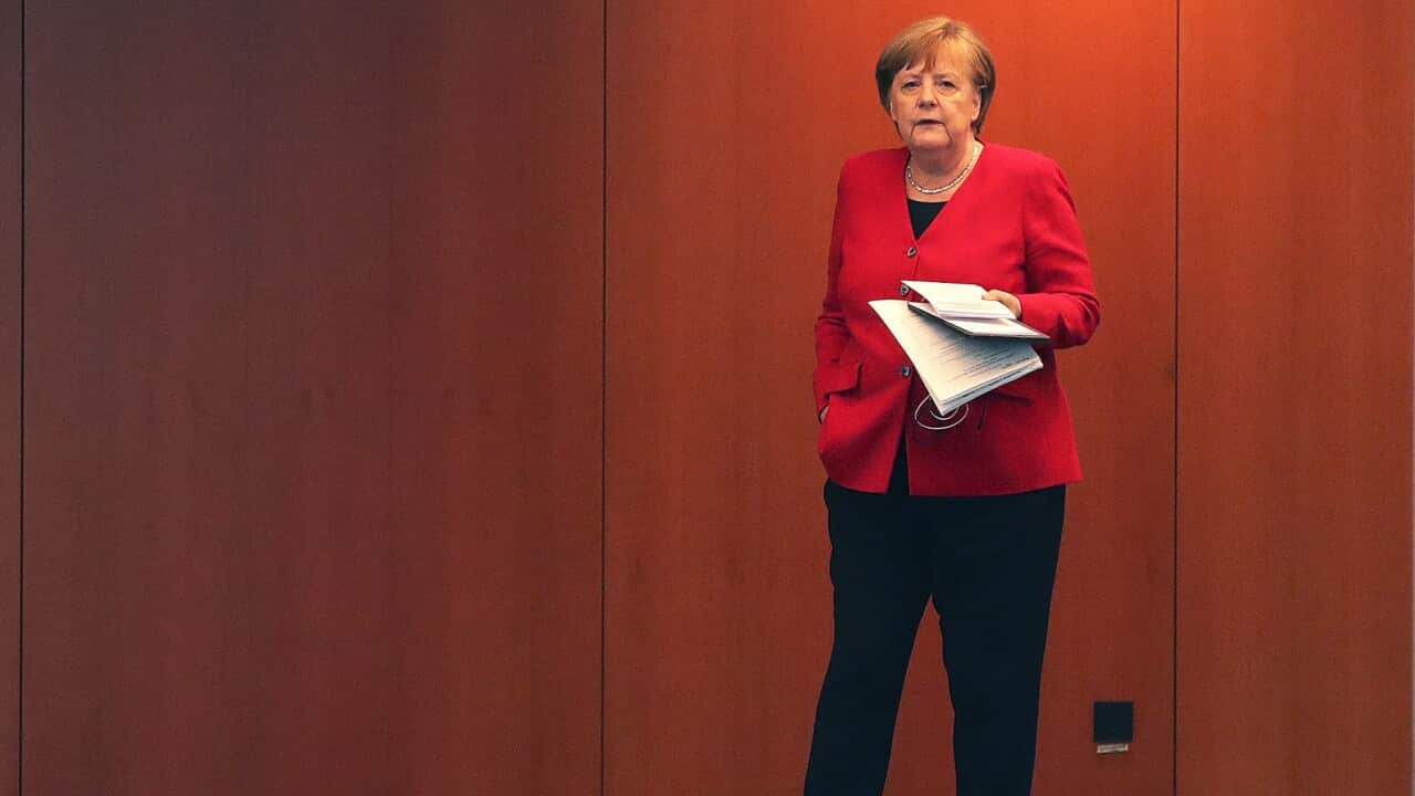 German Chancellor Angela Merkel waits for the beginning of a press conference in Berlin