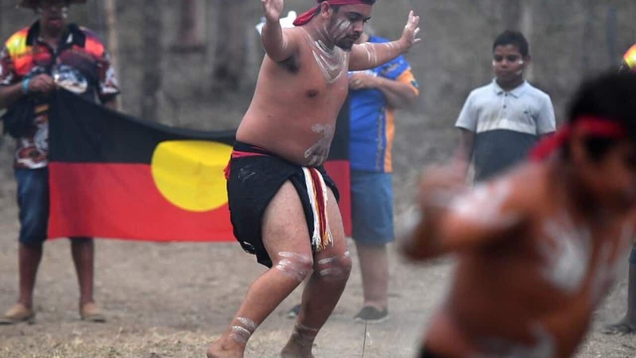 Aboriginal dancers perform a traditional dance in celebration.