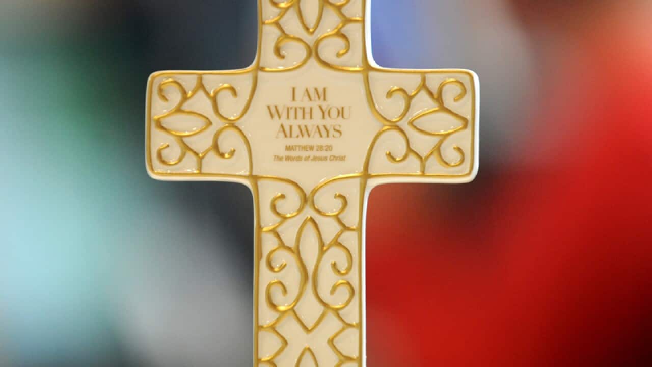 A cross with a Bible inscription